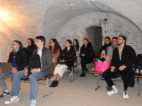 Students work in a bomb shelter during an air raid as part of the hackathon "Town and Gown 2.0: strategic cooperation between the city and the university in the Visegrad Group and Ukraine".